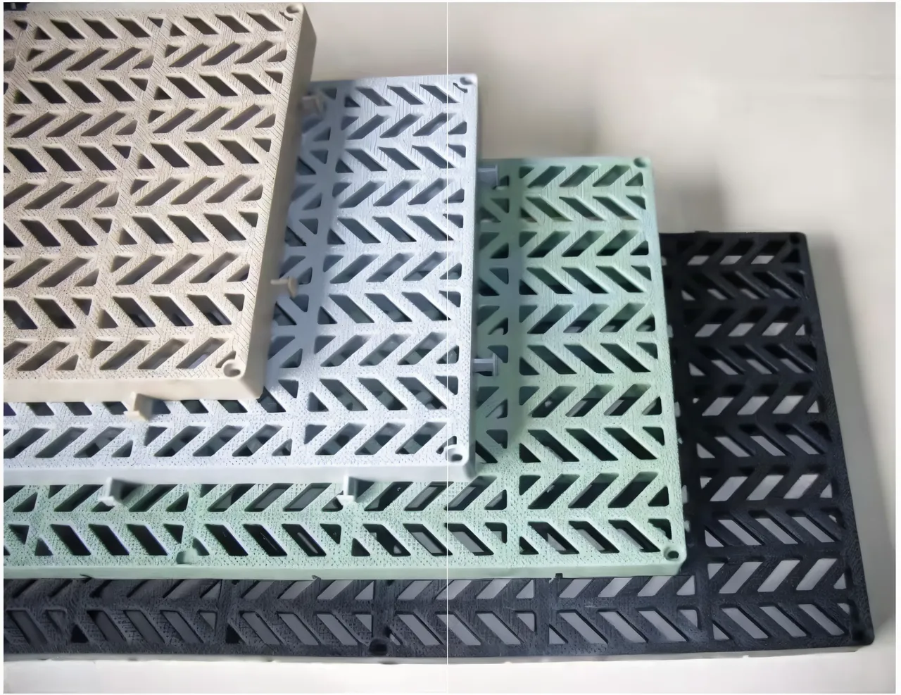PolyGrid walkway panels stacked in beige, grey, green and black