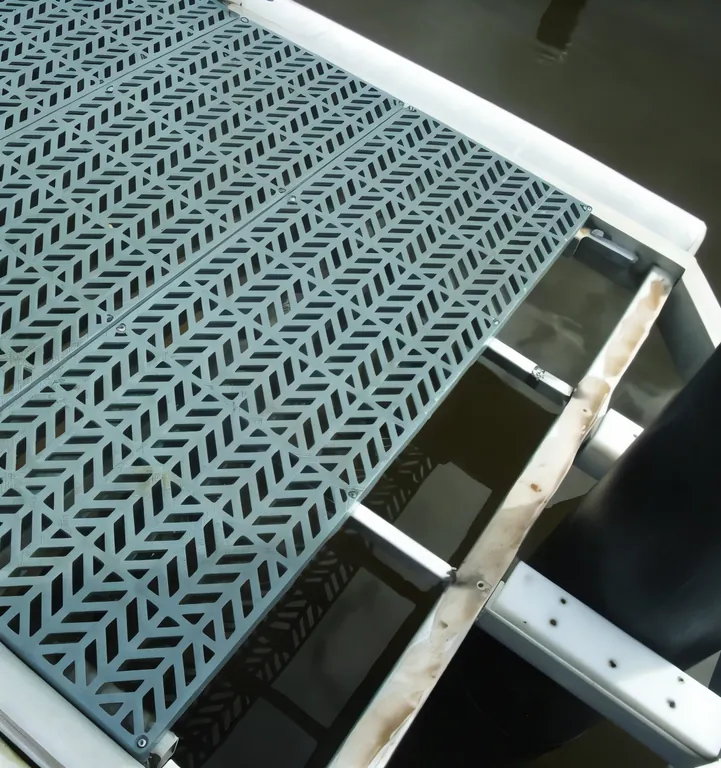 Grey PolyGrid panels decking a walkway over water